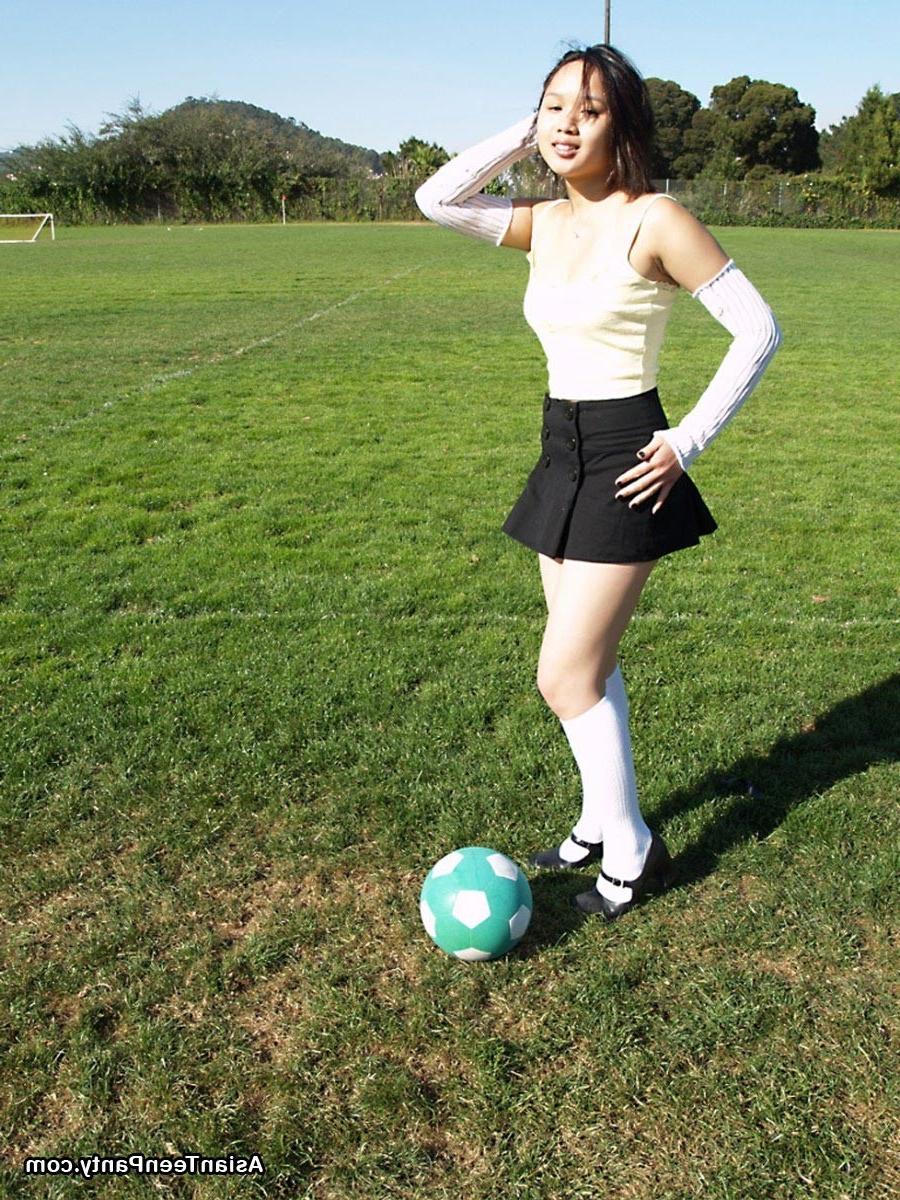 16P Asian teen playing soccer