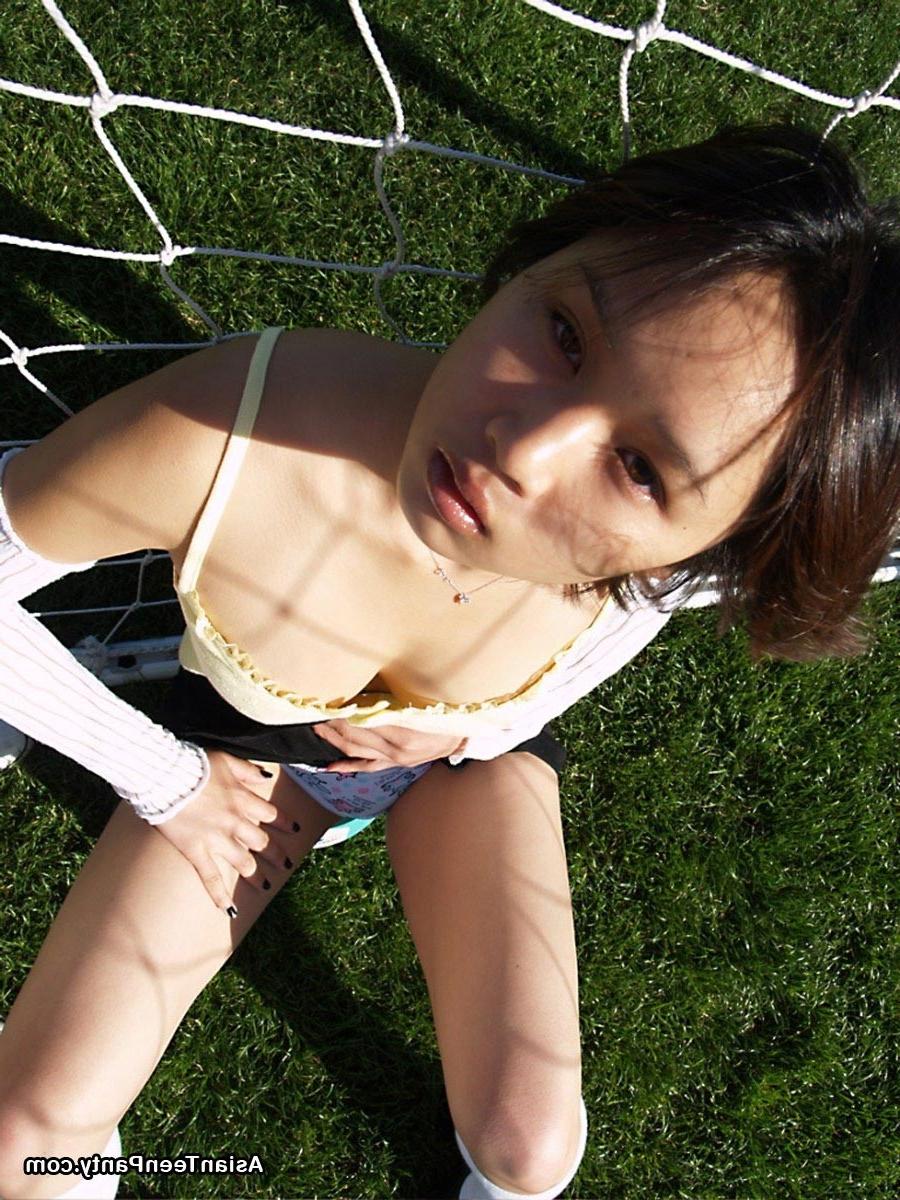 16P Asian teen playing soccer