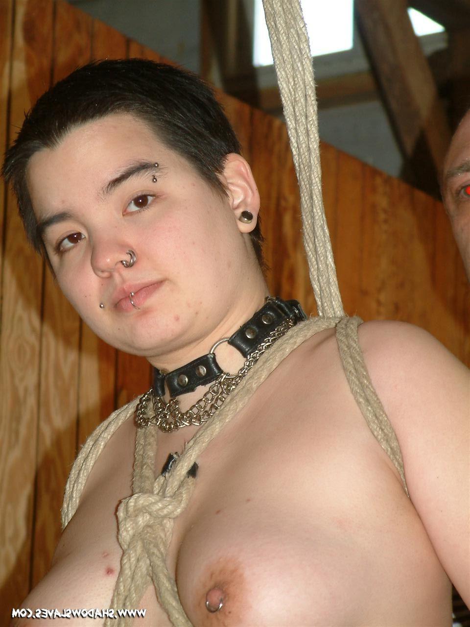14P Oriental slavegirl is suspended in rope bondage