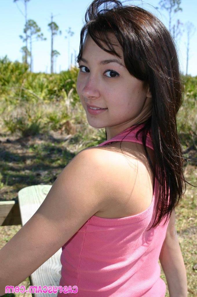 20P Busty asian teen shows cleavage outside