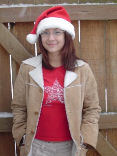16P Asian teen wearing santa hat