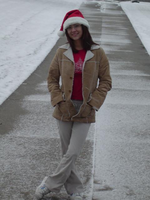 16P Asian teen wearing santa hat