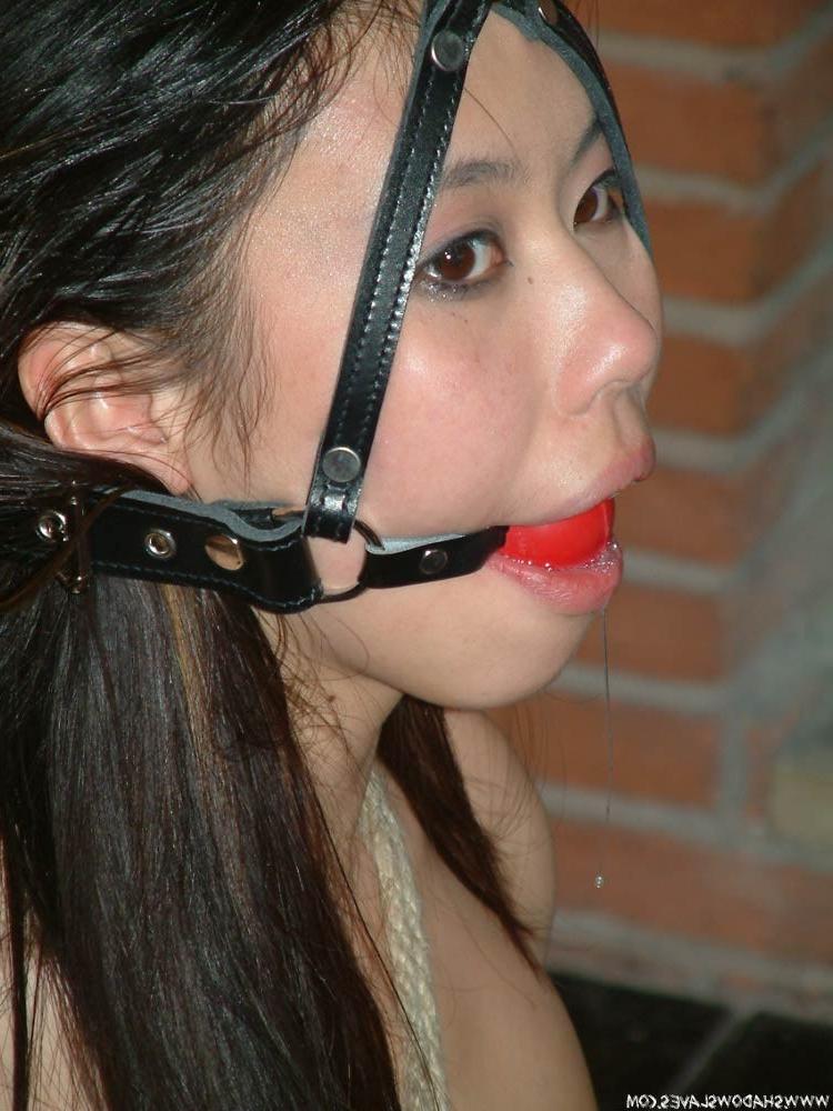 15P Cute oriental babe in bondage
