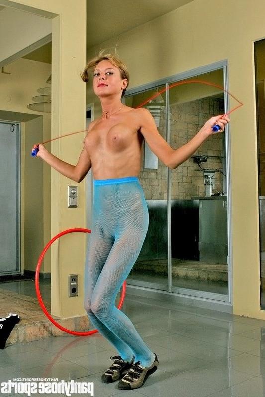 15P Girl in blue fishnet tights exercises