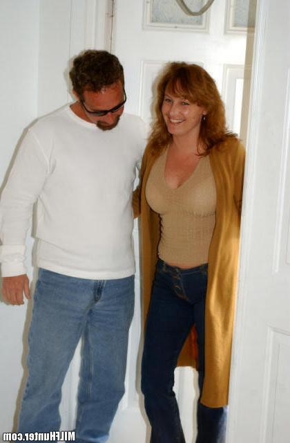 15P Busty redheaded milf having a great time riding the hunters cock