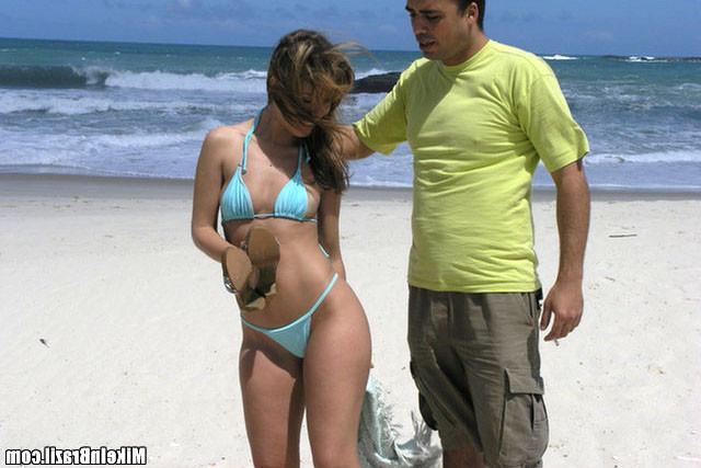 10P This hot brazillian babe takes a hose down of cum in this gallery