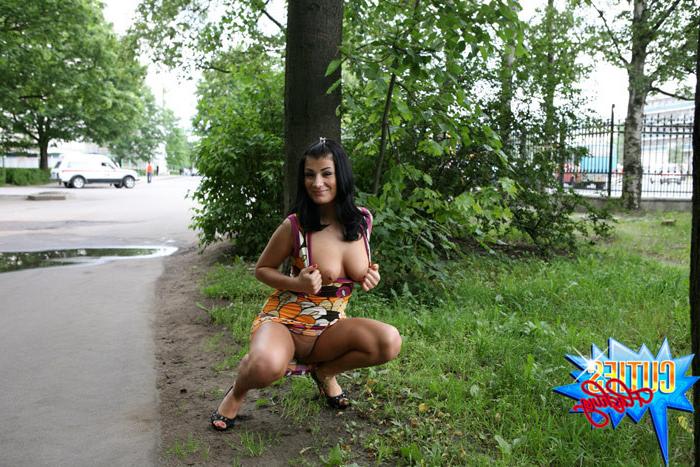 16P Girl rocks the little man in a boat in city park