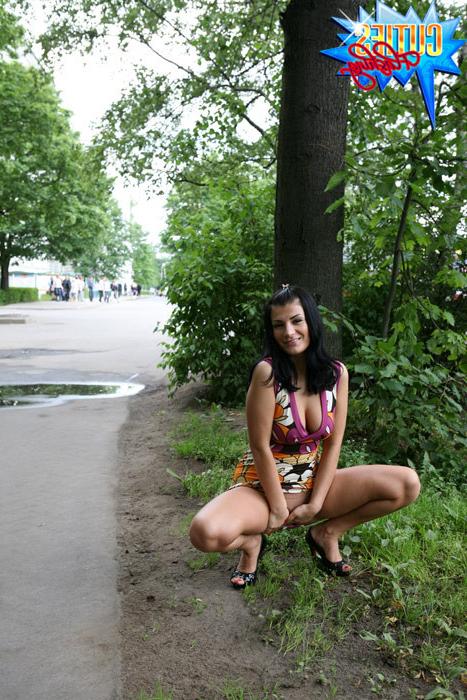 16P Girl rocks the little man in a boat in city park