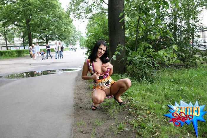 16P Girl rocks the little man in a boat in city park