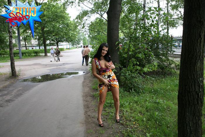 16P Girl rocks the little man in a boat in city park