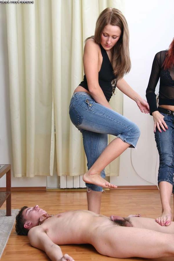 16P Two bitches in tight jeans trample a freak and use him for an ashtray