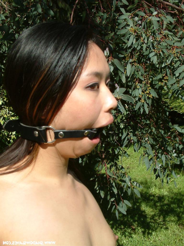 15P Oriental slave tied up outside and hosed down