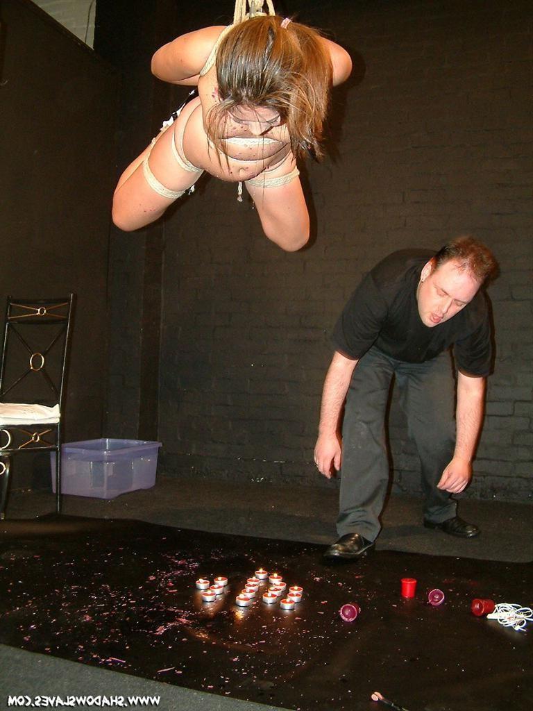 15P Oriental babe in suspension bondage