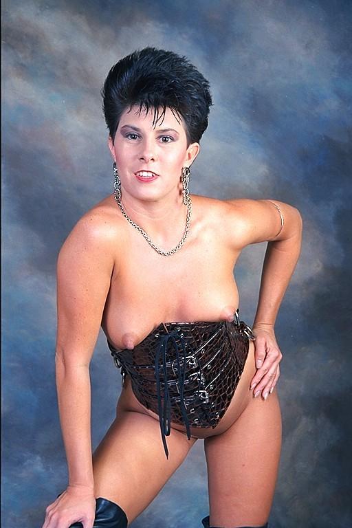 16P sexy brunette model in corsets posing