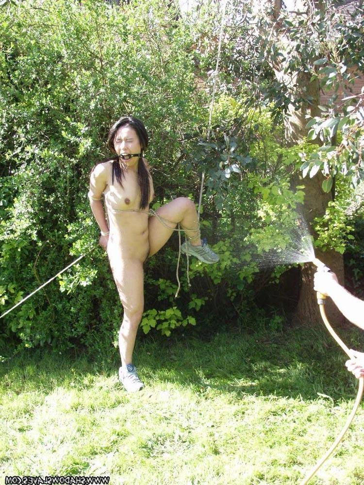 15P Oriental slavegirl bound outdoors and hosed down