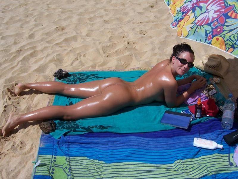15P Her sexy body gets a tan after she strips naked