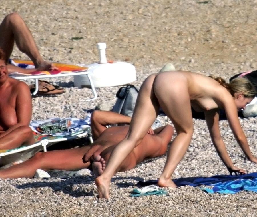 15P Her sexy body gets a tan after she strips naked