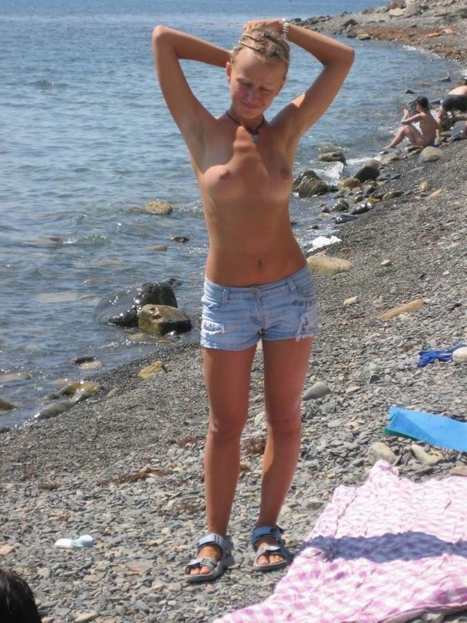 15P Perky breasted teen babe shows off her nude body
