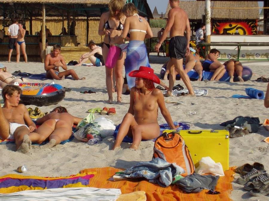 15P Her sexy body gets a tan after she strips naked