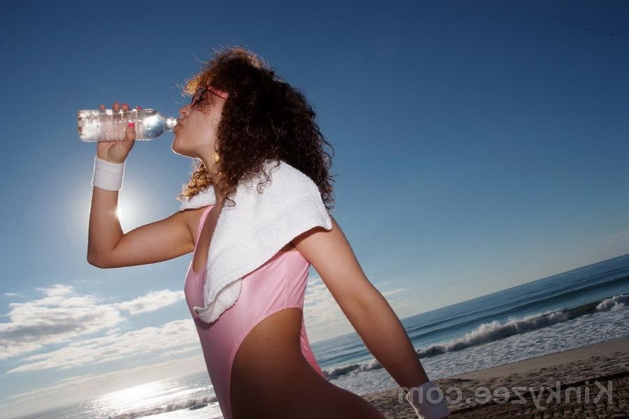 15P Kinky working out on the beach in a very sexy thong swimsuit