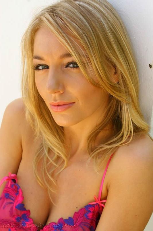 16P Gorgeous blonde in pink floral camisole french knickers and black stockings.