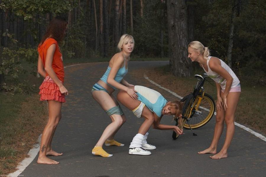 15P Four gorgeous petite teens having fun nude in a forest