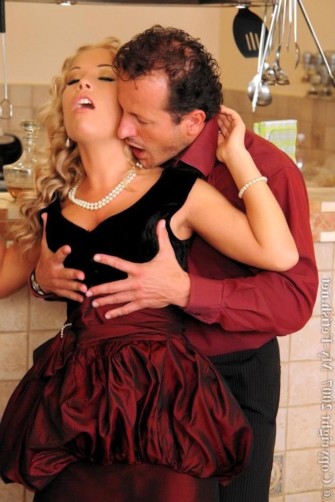 16P Glamour beauty in stockings gives a footjob to her man
