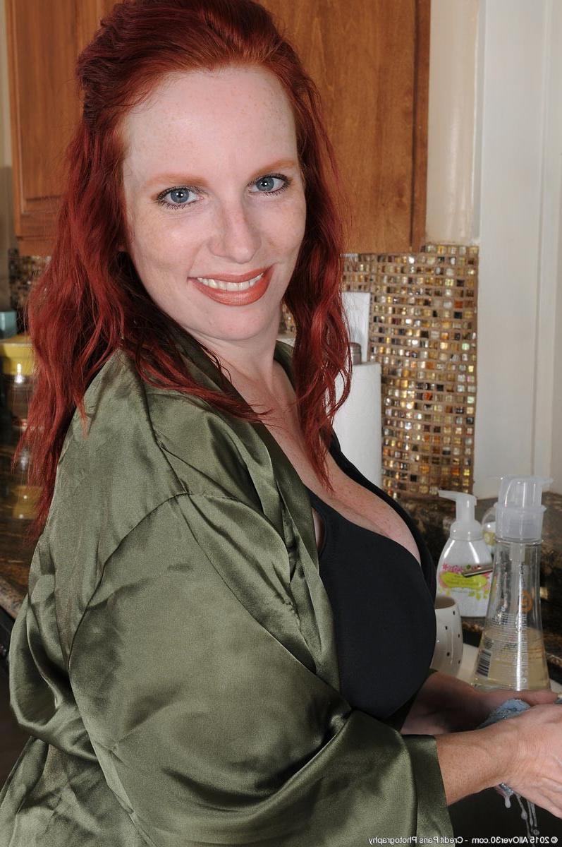 15P Busty redhead milf strips in the kitchen