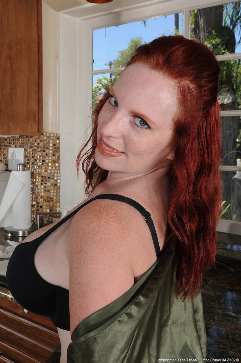 15P Busty redhead milf strips in the kitchen
