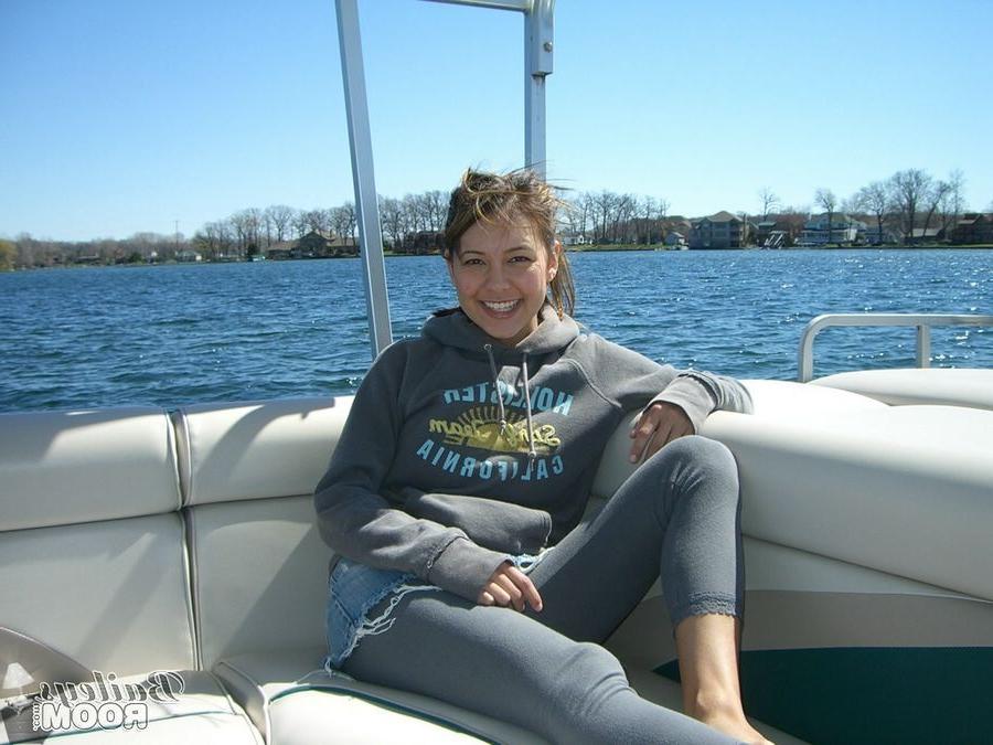 15P Bailey is a cute brunette with hard nipples posing on a boat