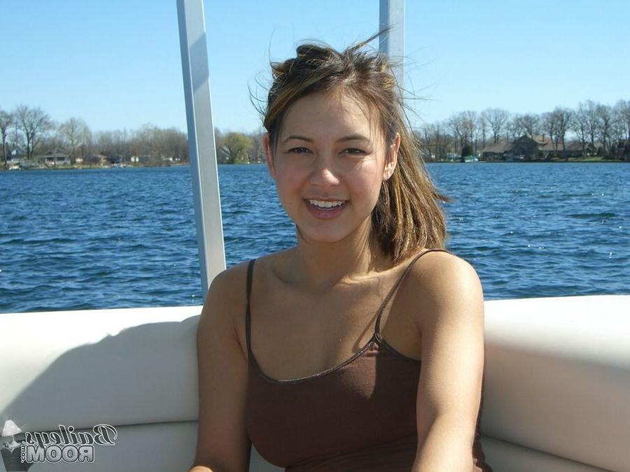 15P Bailey is a cute brunette with hard nipples posing on a boat