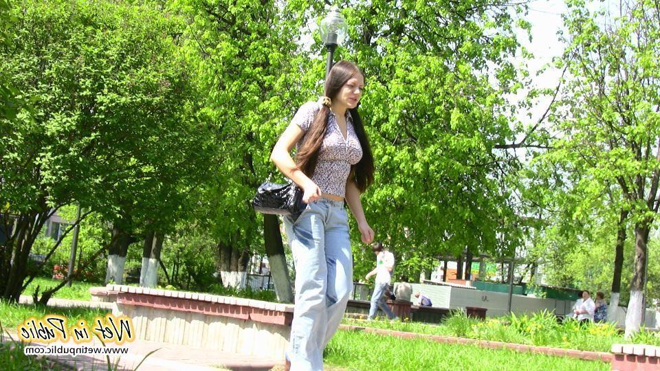 16P Bigtitted and longhaired amateur wets her blue jeans in a public park