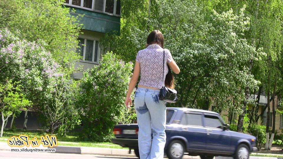 16P Bigtitted and longhaired amateur wets her blue jeans in a public park