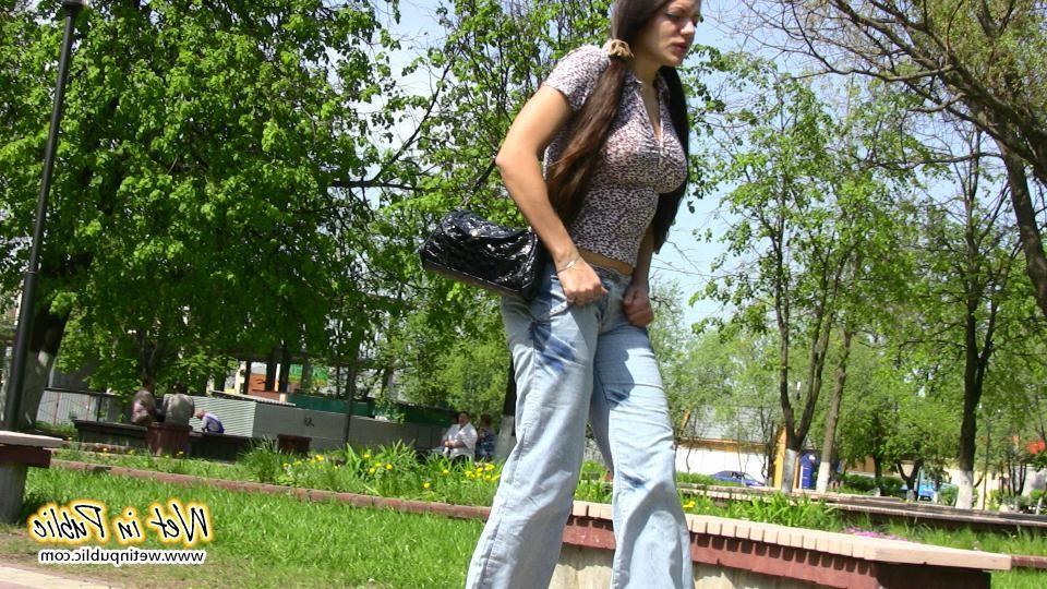 16P Bigtitted and longhaired amateur wets her blue jeans in a public park