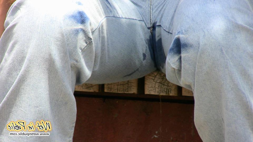 16P Bigtitted and longhaired amateur wets her blue jeans in a public park