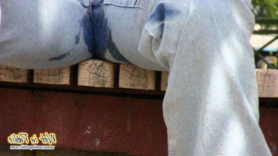 16P Bigtitted and longhaired amateur wets her blue jeans in a public park