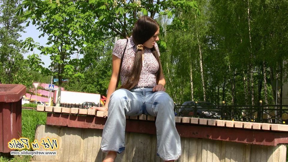 16P Bigtitted and longhaired amateur wets her blue jeans in a public park