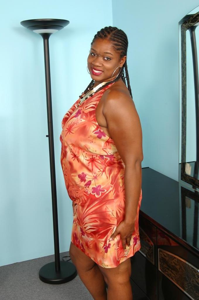 20P Busty ebony milf loves strip teasing in a red dress