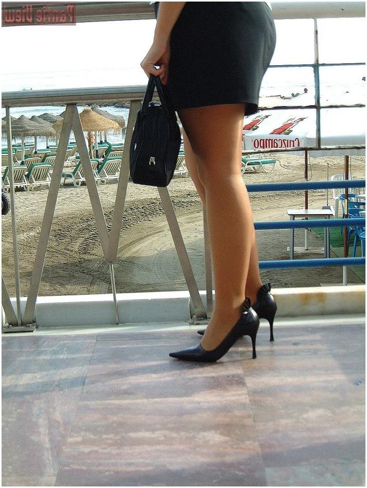 15P Blonde showing here white panties under here pantyhose outdoors