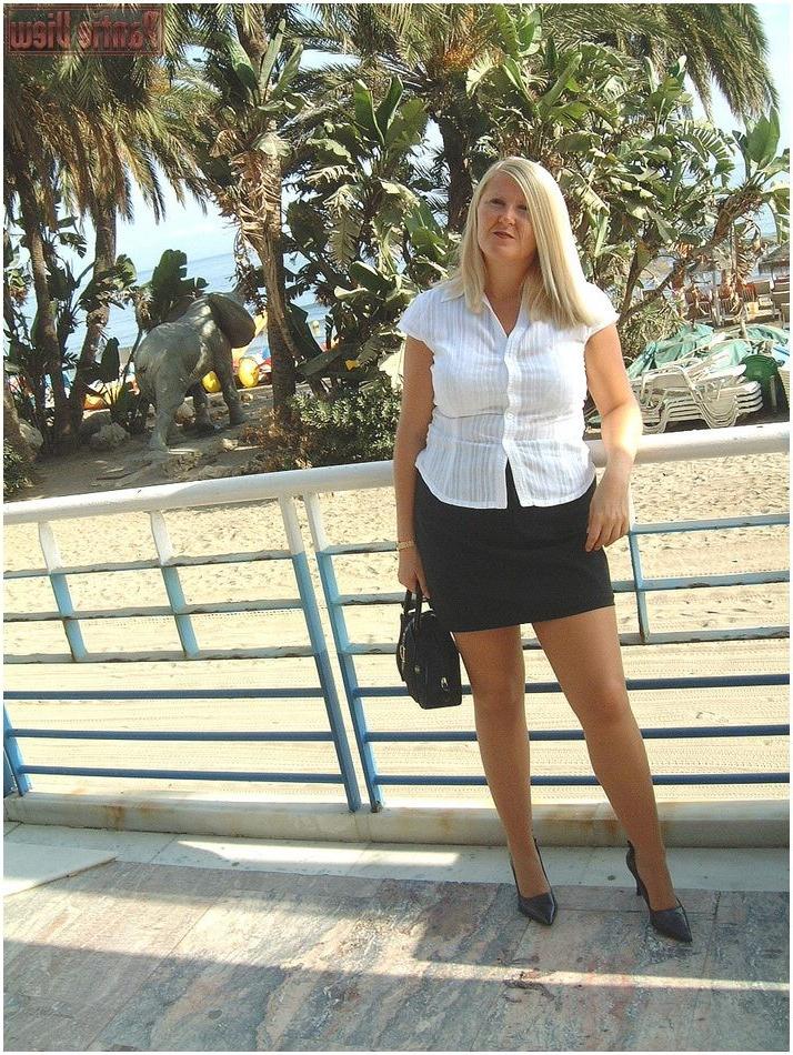 15P Blonde showing here white panties under here pantyhose outdoors