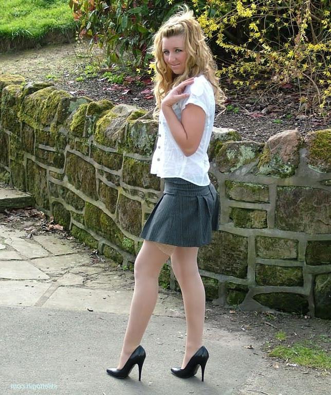 15P Shy blonde babe in stockings and heels outdoors