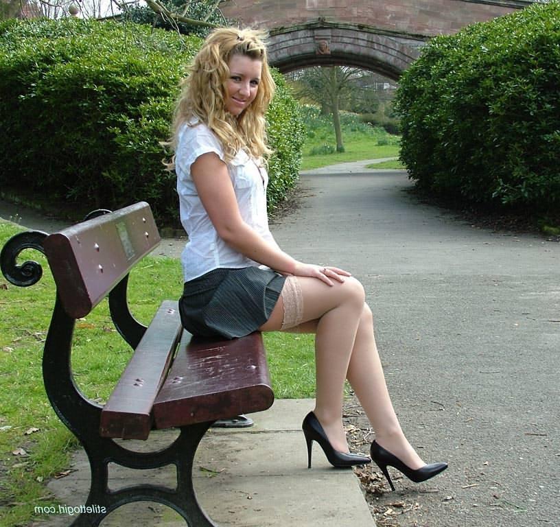 15P Shy blonde babe in stockings and heels outdoors