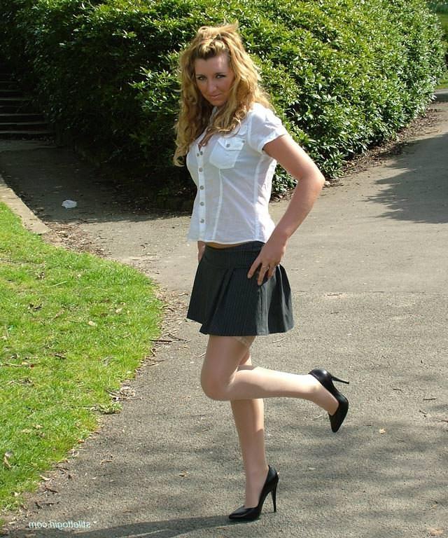 15P Shy blonde babe in stockings and heels outdoors