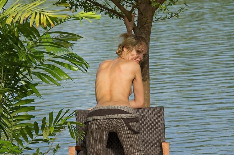 17P Stunning small titted blonde showing sensual striptease outdoors