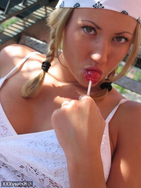 16P Busty Blonde Kelsey Sucking a Lollipop and Showing Boobs