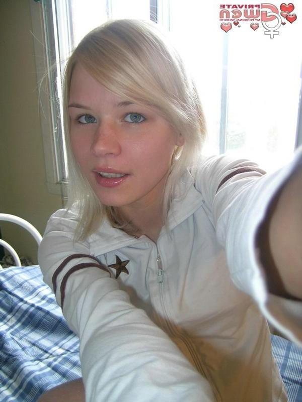 15P Young blonde teen rubs oil on her little tits and nipples