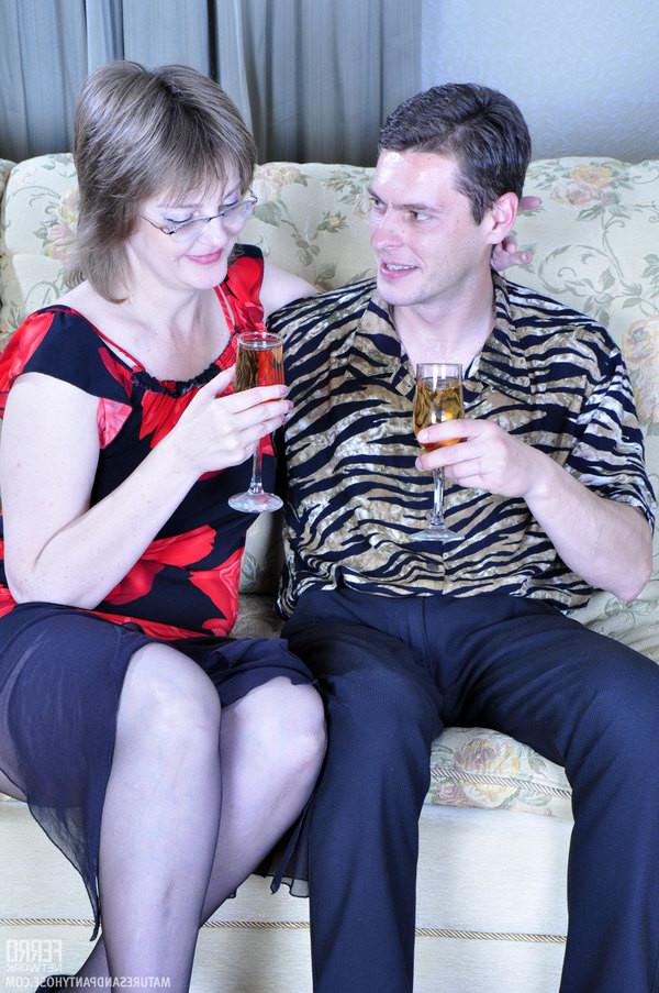 20P Salacious mom slides her hand into her black tights while blowin