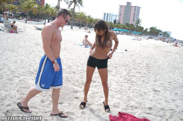 15P Busty beach milf does a hot striptease before sucking on her knees