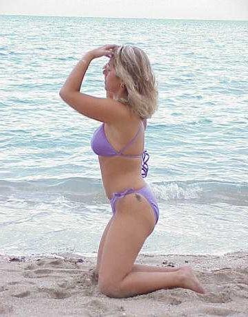 13P Babe getting naked on the beach has a freakish big clits