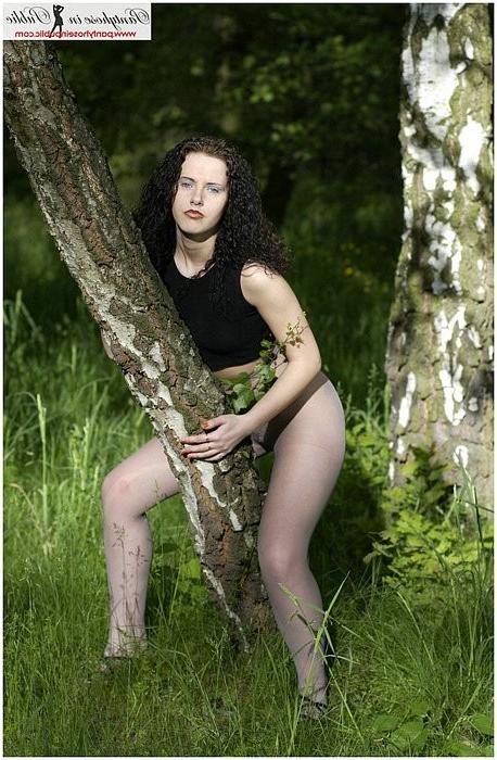 15P Sexy brunette teen wears only her grey sheer pantyhose outdoors